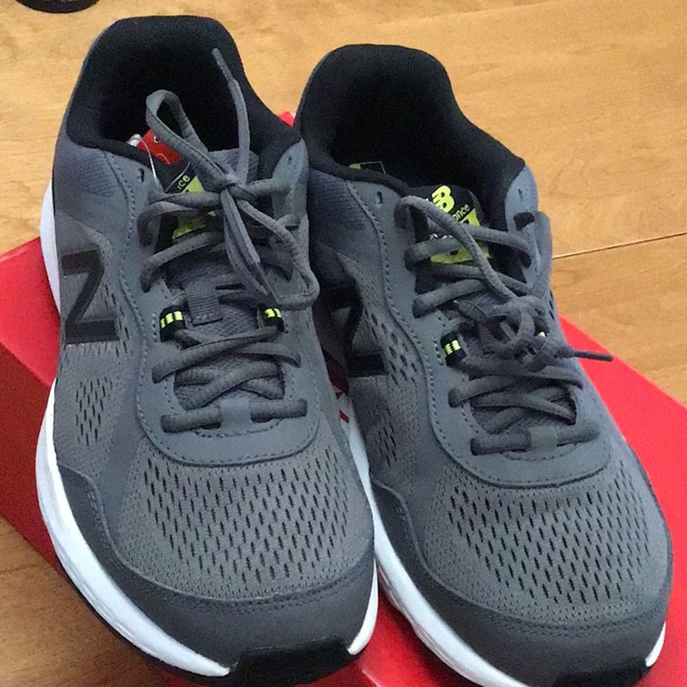 Men’s New Balance running shoes, dark gray with black heel. 8 extra wide (4E).
